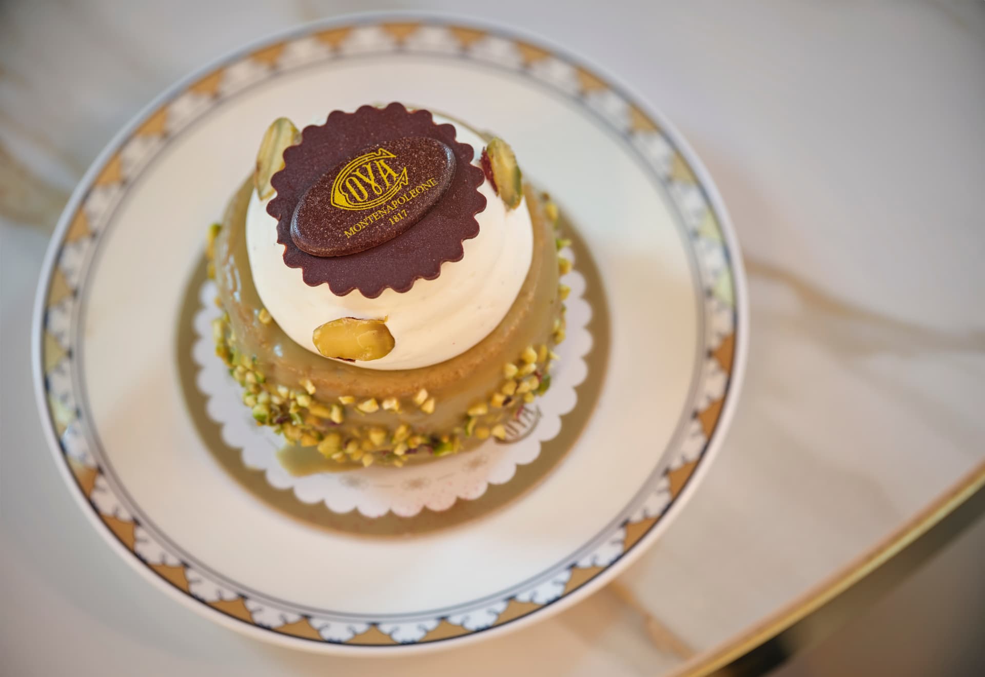 Cova pistachio pastry with the Cova Montenapoleone chocolate seal