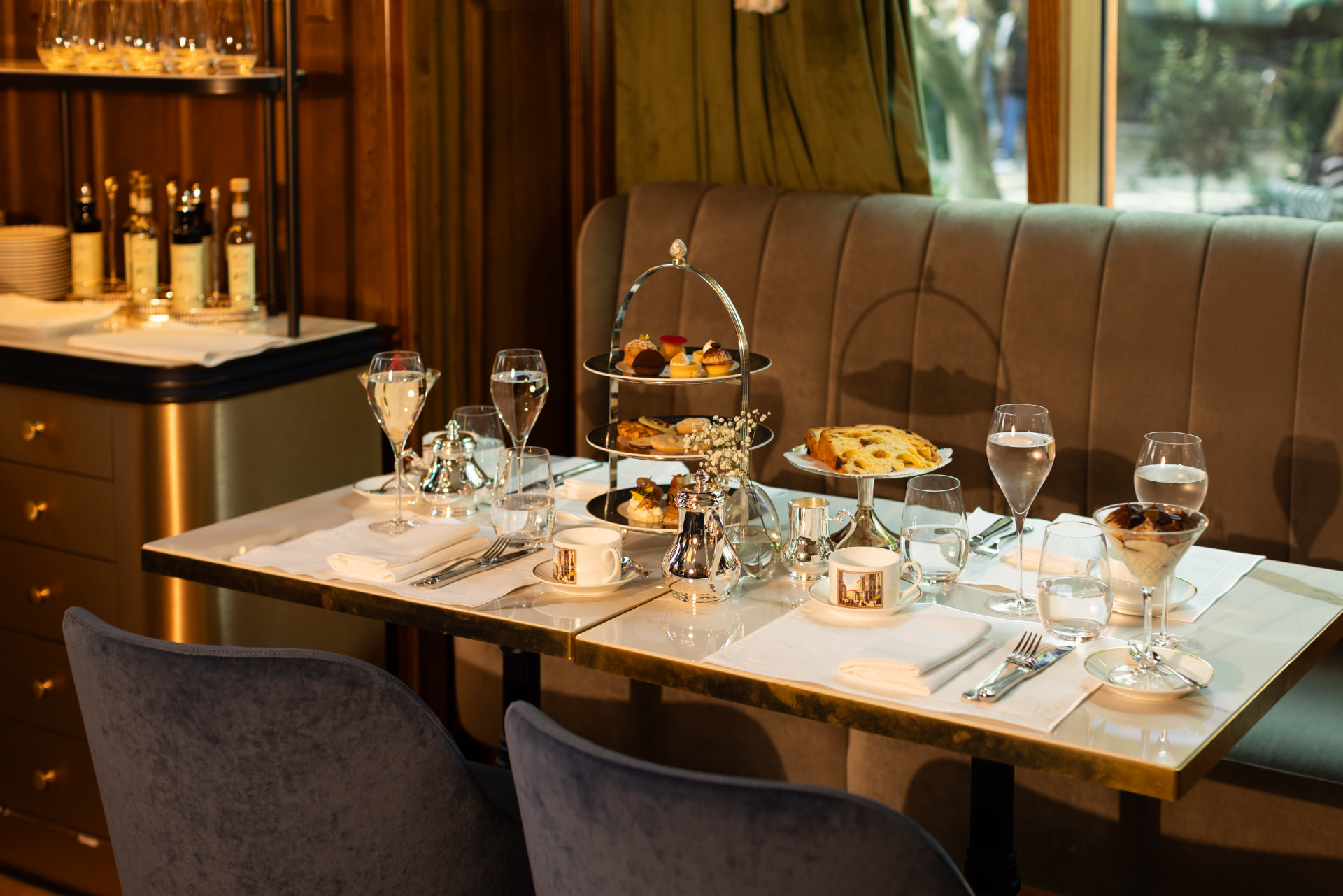 Cova afternoon tea stand with pastries and tea