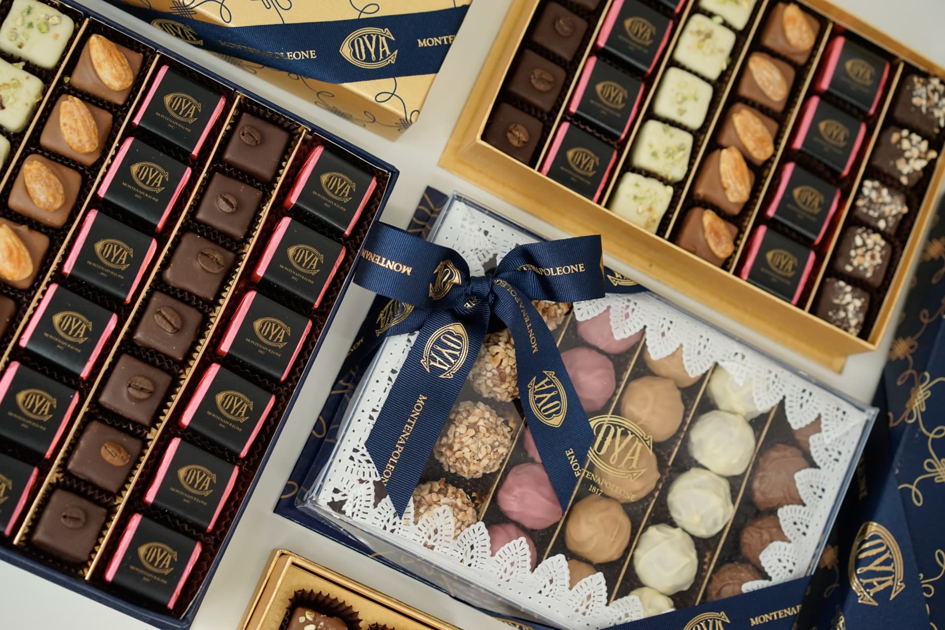 Cova chocolate boxes and pralines with navy ribbon